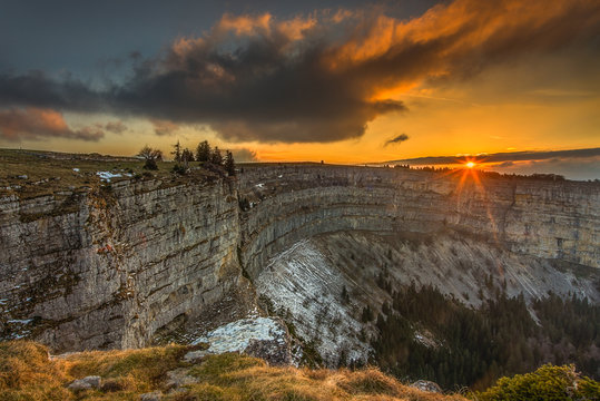 Scenic view of Creux du Van during sunset