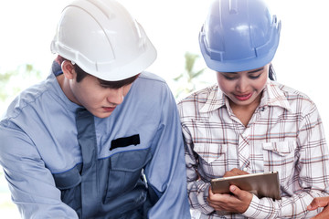 Engineers man and woman construction team on work site