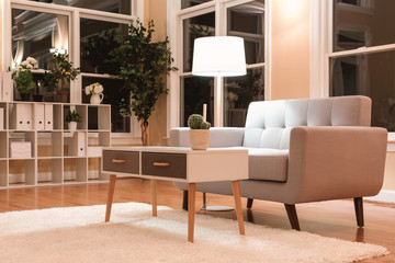 Large luxury interior home with gray midcentury loveseat