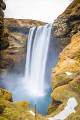 Long Exposure shot of Skogafoss waterfall in Iceland. Soft focus and motion blur due to long exposure shot