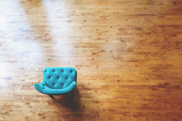 Overhead view of a turquoise chair in a large luxury home
