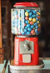 gamble eggs in vintage gumball machine at grocery store