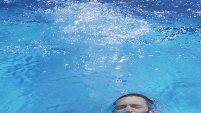 Young Man exit Water of Swimming Pool, Slow Motion