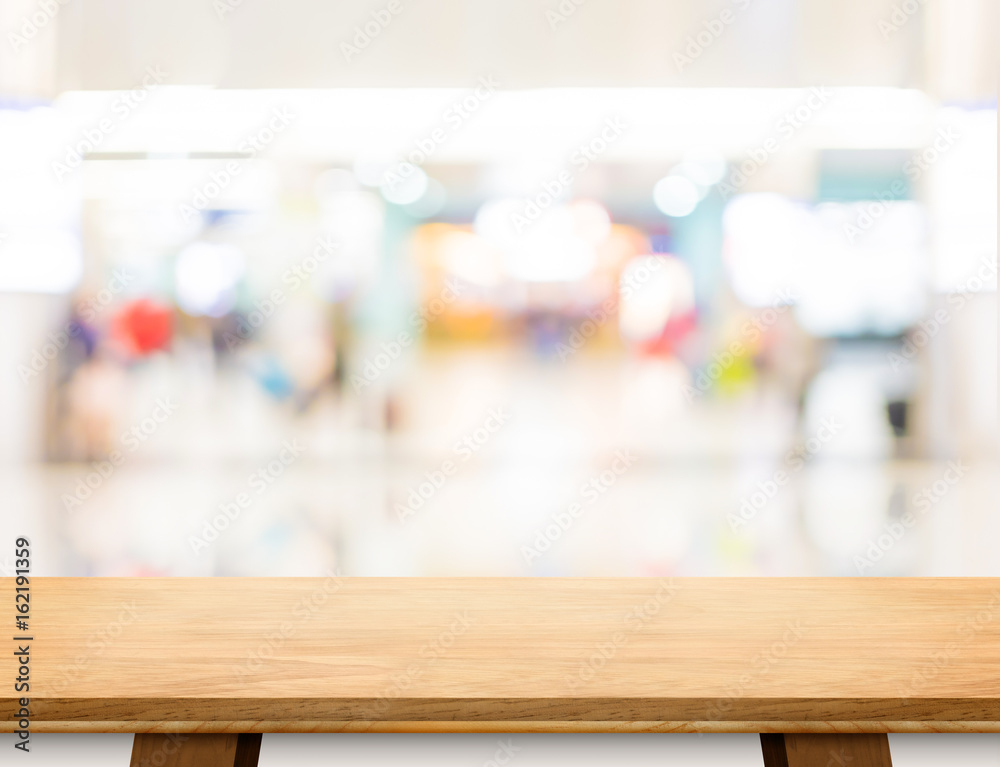 Poster Empty wood board table at blur department store bokeh light background,Mock up for display or montage of product or design