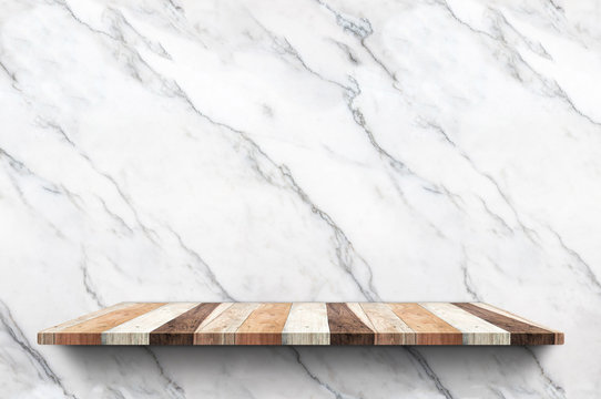 Empty wood plank shelf at white marble wall background,Mock up for display or montage of product or design