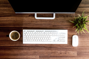 Computer and working place on wooden table