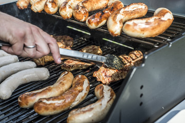 Barbecue grill bbq on propane gas grill steaks bratwurst sausages meat meal