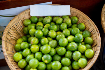 Green-Lemons  in the basket
