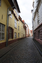 Narrow street in old city in Lubeck, Germany