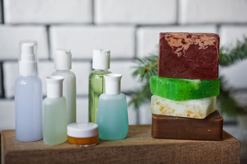 Bathroom accessories. Body care. Multi-colored natural soap, gels, shampoos, balms in vials, sea...