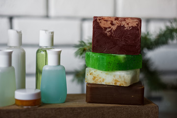 Bathroom accessories. Body care. Multi-colored natural soap, gels, shampoos, balms in vials, sea...