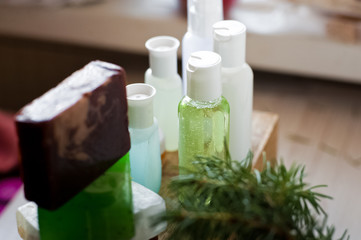 Bathroom accessories. Body care. Multi-colored natural soap, gels, shampoos, balms in vials, sea...