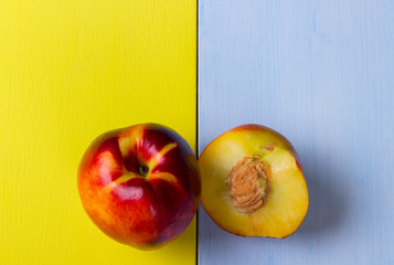 Peachs on a yellow and blue background.