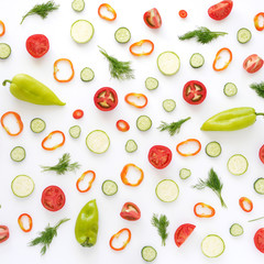 Vegetables on a white background. Pattern of vegetables. Food background. Collage of food. Top view. Composition of  peppers, cucumbers, tomatoes, dill.