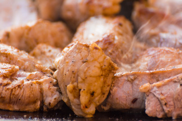 The meat is cooked in a cauldron