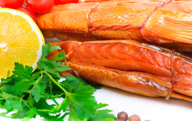 Smoked fish on plate close up
