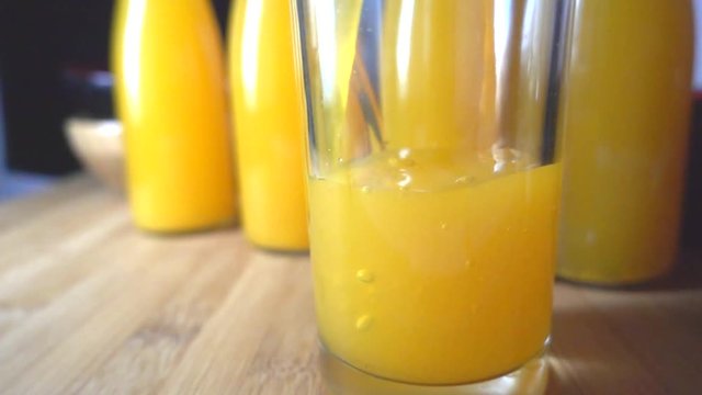 Pouring orange juice, slow motion