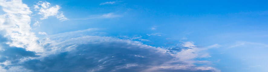 Panorama white fluffy clouds in the blue sky