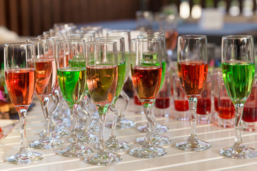 lot of colorful drinks on buffet table