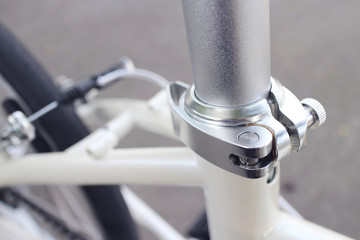 detail of bicycle seat clamp, shallow depth of field, filter effect