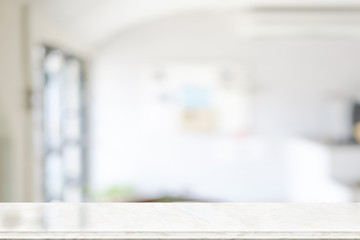 Empty marble top table with blurred coffee shop interior Background.