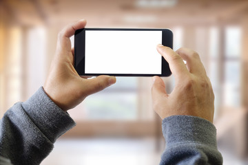 man using smart phone on window with city building background
