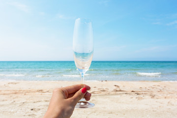 Glass of wine on beach