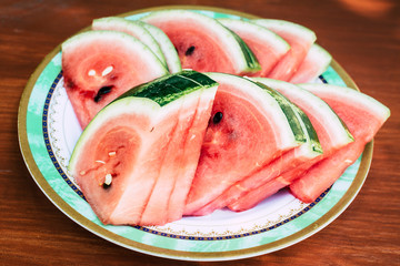 Slices of watermelon on a wooden table. Top view