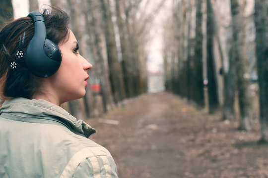girl in park with headphone