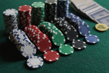 Poker chips and cards on the cloth