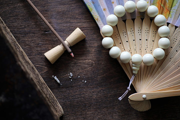 Beads and Incense on wooden table