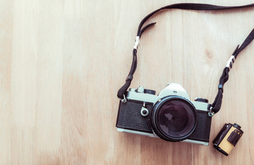 Vintage camera on wooden background
