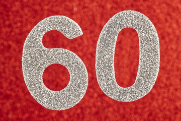 Number sixty silver color over a red background. Anniversary. Horizontal