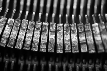 Different small metal elements of an old typewriter
