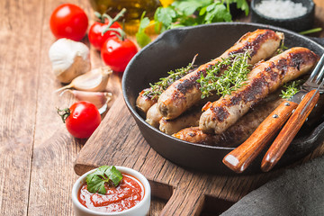 Grilled sausages with sauce