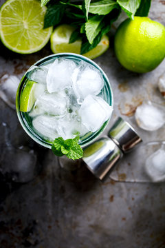 Mojito Cocktail.Mint, lime, ice ingredients for making  and bar utensils.Cold Drink.Top View.Copy space for Text.selective focus.