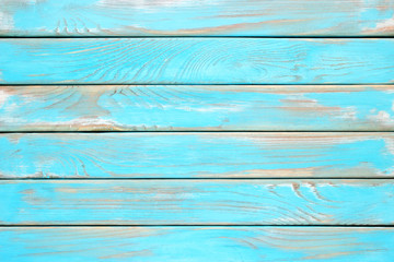 Blue wood planks, a shabby wooden surface of the kitchen table