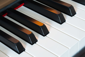 Piano keys side view with warm light