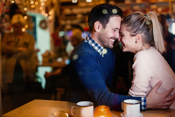 Young attractive couple on date in bar