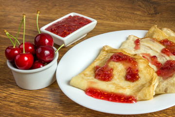 Pancakes with strawberry jam.