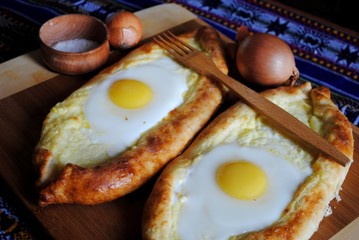 Khachapuri in Adjara with the egg. The Georgian cuisine.