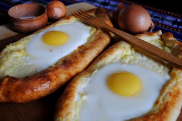 Khachapuri in Adjara with the egg. The Georgian cuisine.
