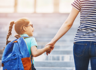 Parent and pupil go to school