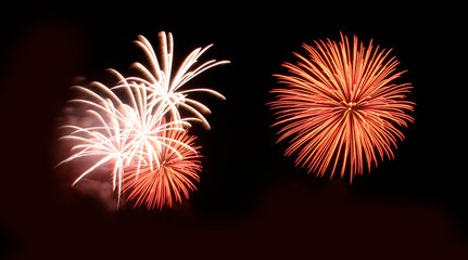 Fototapeta premium Abstract fireworks light up in the sky at night