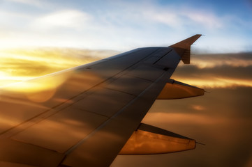 Fototapeta na wymiar Airplane Wing Sunset