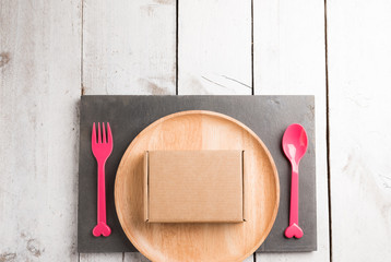 Cardboard box on a wooden background