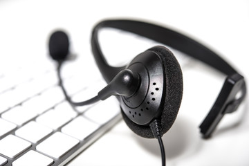 Microphone headset on computer keyboard
