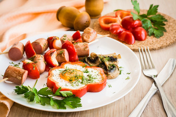 Eggs in peppers, mushrooms and sausage with peppers on skewers