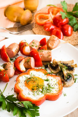 Eggs in peppers, mushrooms and sausage with peppers on skewers