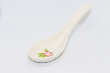 White short spoon with flower piant